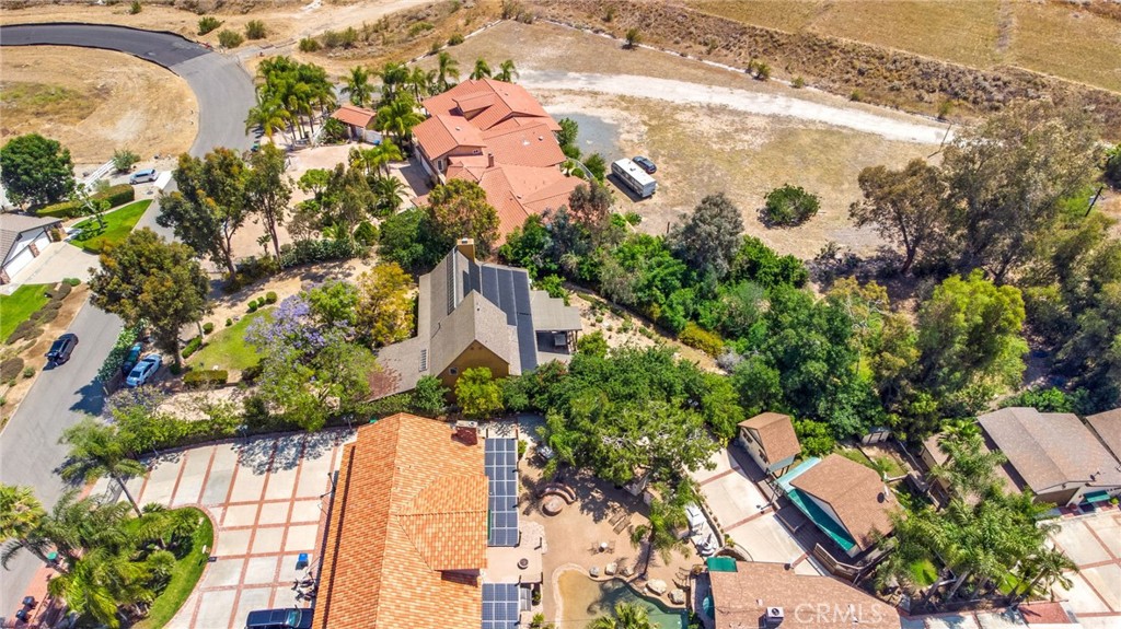 7241 Old Temescal Road Corona, CA 92881 - Photo 37 of 47 an aerial view of a house with a yard and lake view in back