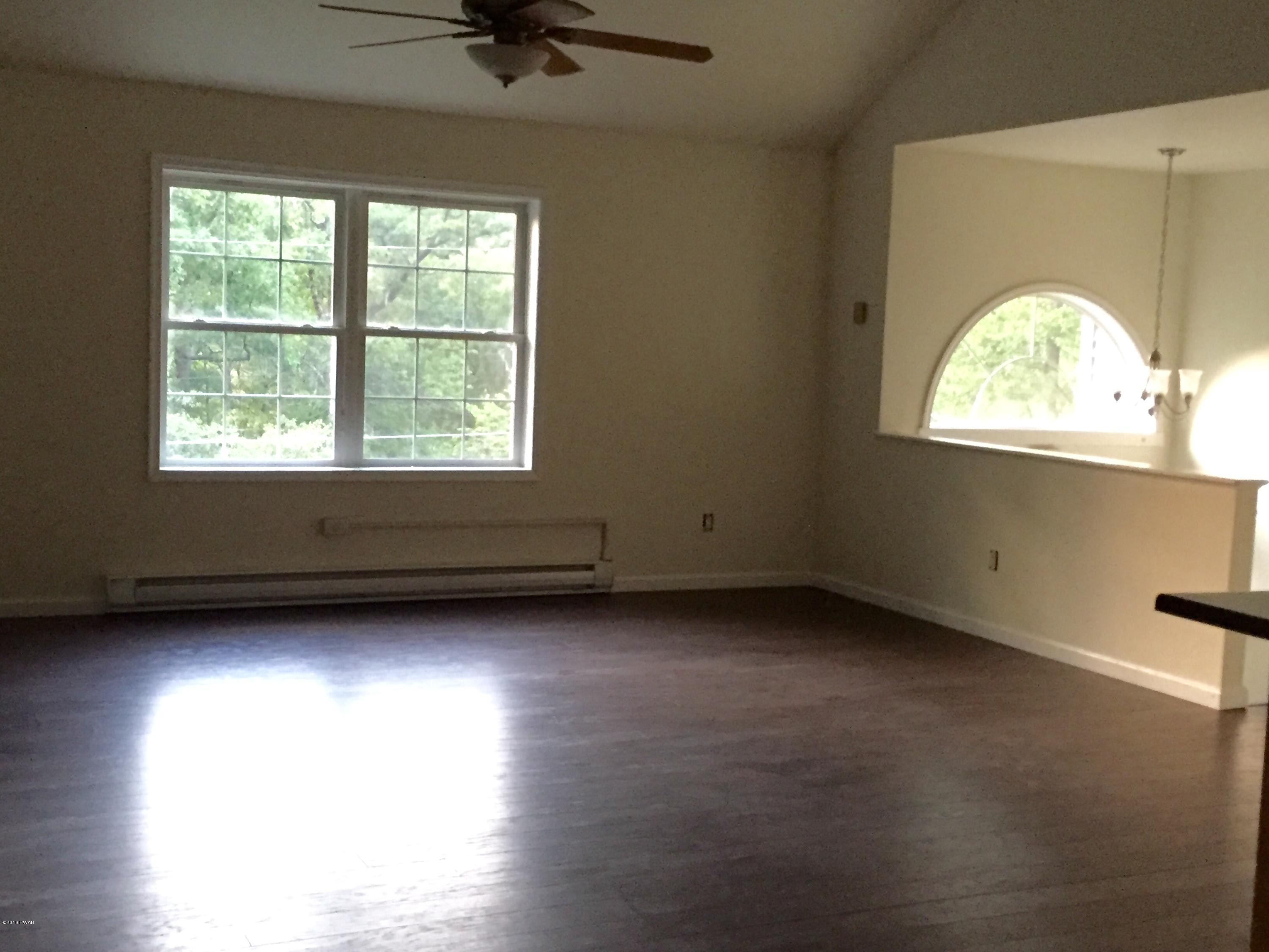 158 Yale Road Milford, PA 18337 - Photo 13 of 13 an empty room with wooden floor and windows
