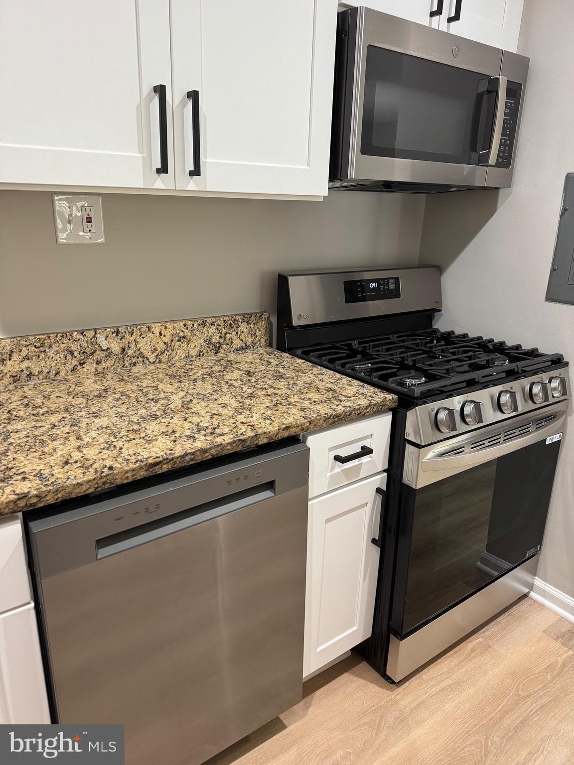 3817 Swann Road, Unit 302 Suitland, MD 20746 - Photo 15 of 26 a kitchen with stainless steel appliances granite countertop a sink and a stove