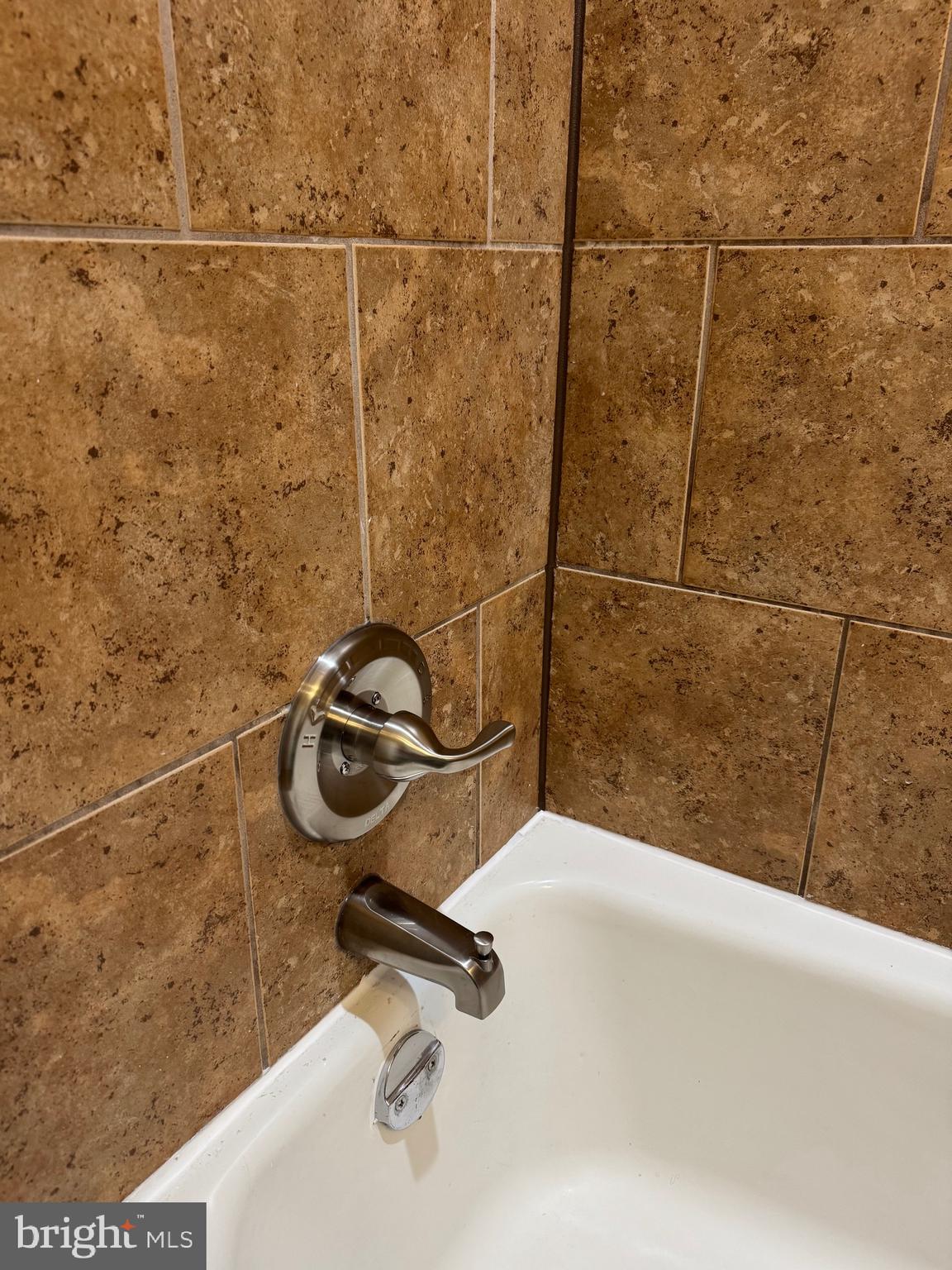 3817 Swann Road, Unit 302 Suitland, MD 20746 - Photo 18 of 26 a bathroom with a shower