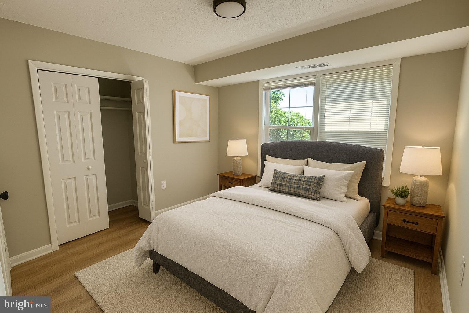 3817 Swann Road, Unit 302 Suitland, MD 20746 - Photo 4 of 26 a bedroom with a bed and a window