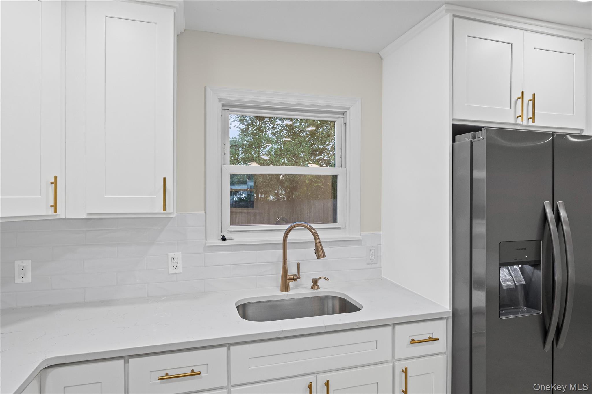31 Colony Road Port Jefferson Station, NY 11776 - Photo 14 of 32 a bathroom with a sink and a window