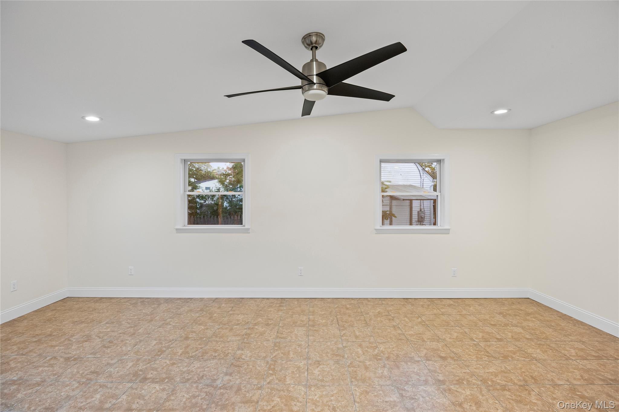 31 Colony Road Port Jefferson Station, NY 11776 - Photo 16 of 32 a view of a livingroom with a ceiling fan and window
