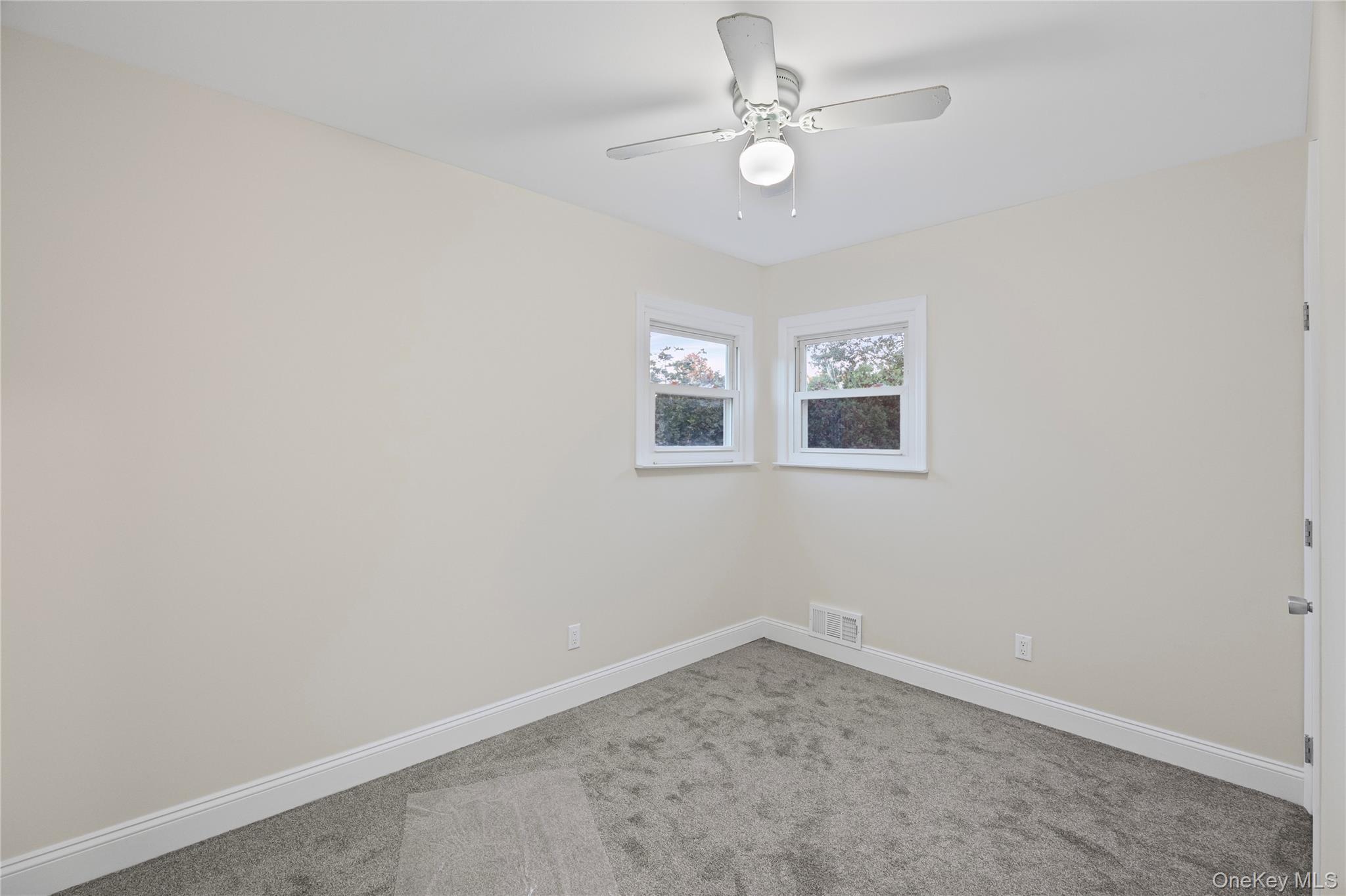 31 Colony Road Port Jefferson Station, NY 11776 - Photo 21 of 32 an empty room with a fan