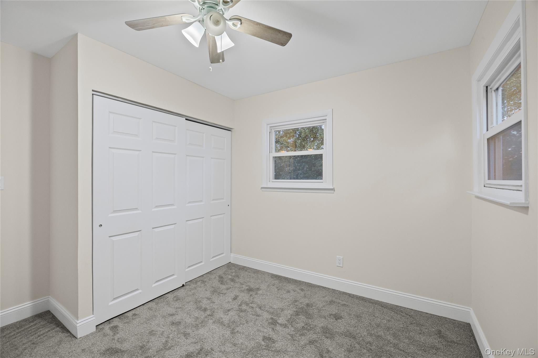 31 Colony Road Port Jefferson Station, NY 11776 - Photo 25 of 32 an empty room with a chandelier fan