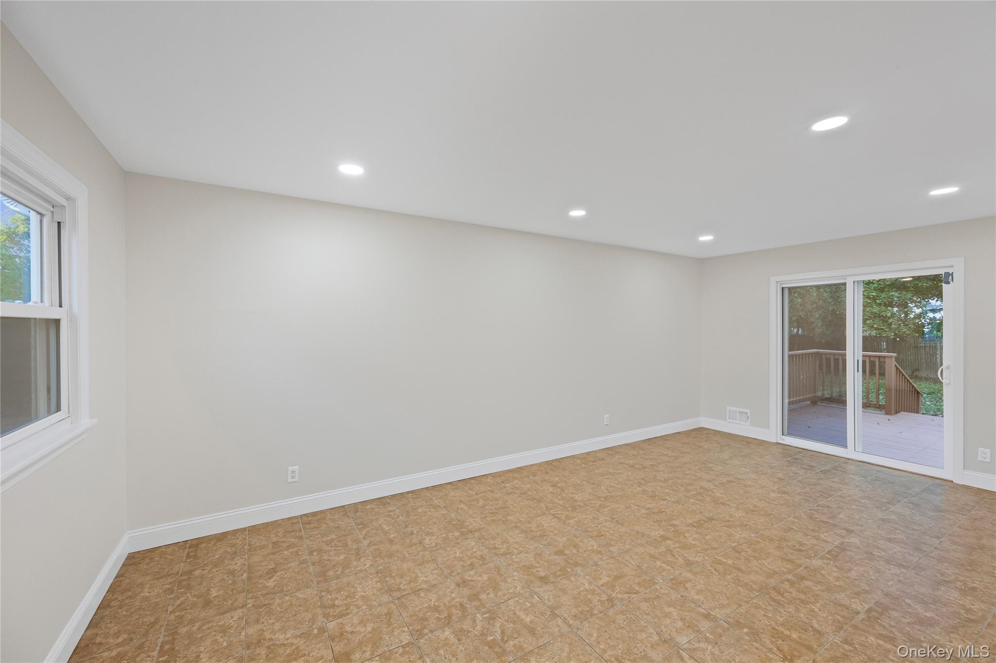 31 Colony Road Port Jefferson Station, NY 11776 - Photo 5 of 32 an empty room with windows