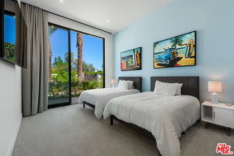 a bathroom with a sink toilet a mirror and shower