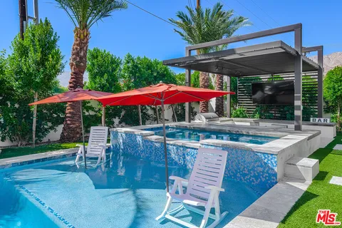 a view of swimming pool with a patio