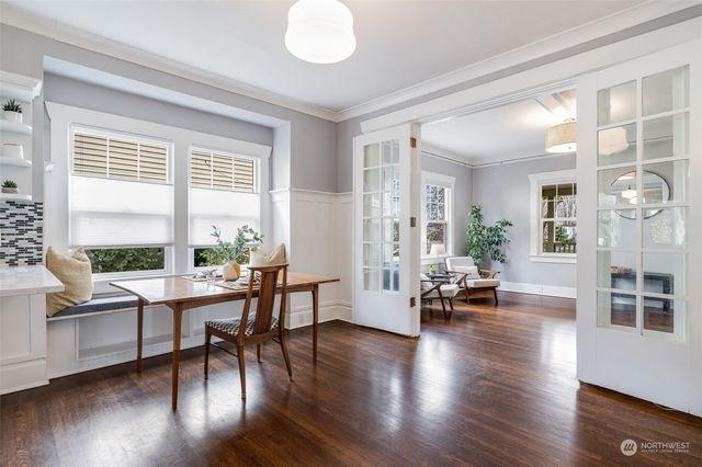 a view of a a dining room with furniture and wooden floor