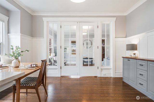 a view of a dining room with furniture and wooden floor