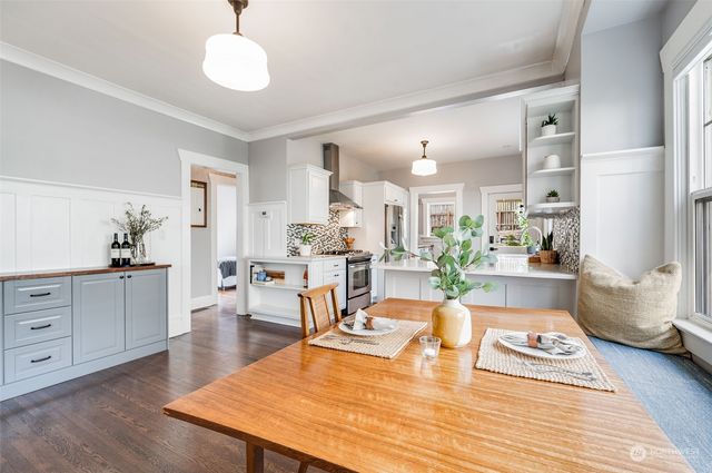 a view of a dining room with furniture and wooden floor