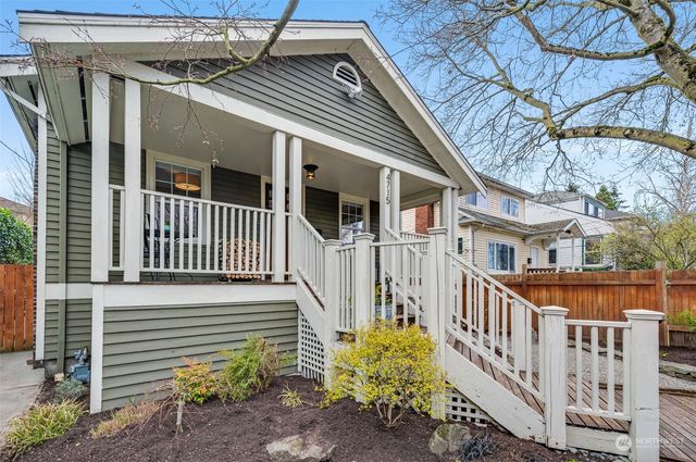 a view of a house with wooden fence