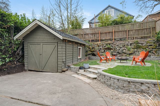 an aerial view of a house with an outdoor space