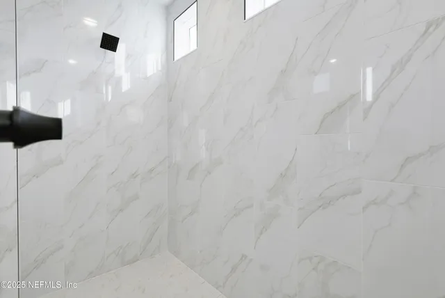 a view of a large pool with an ocean view