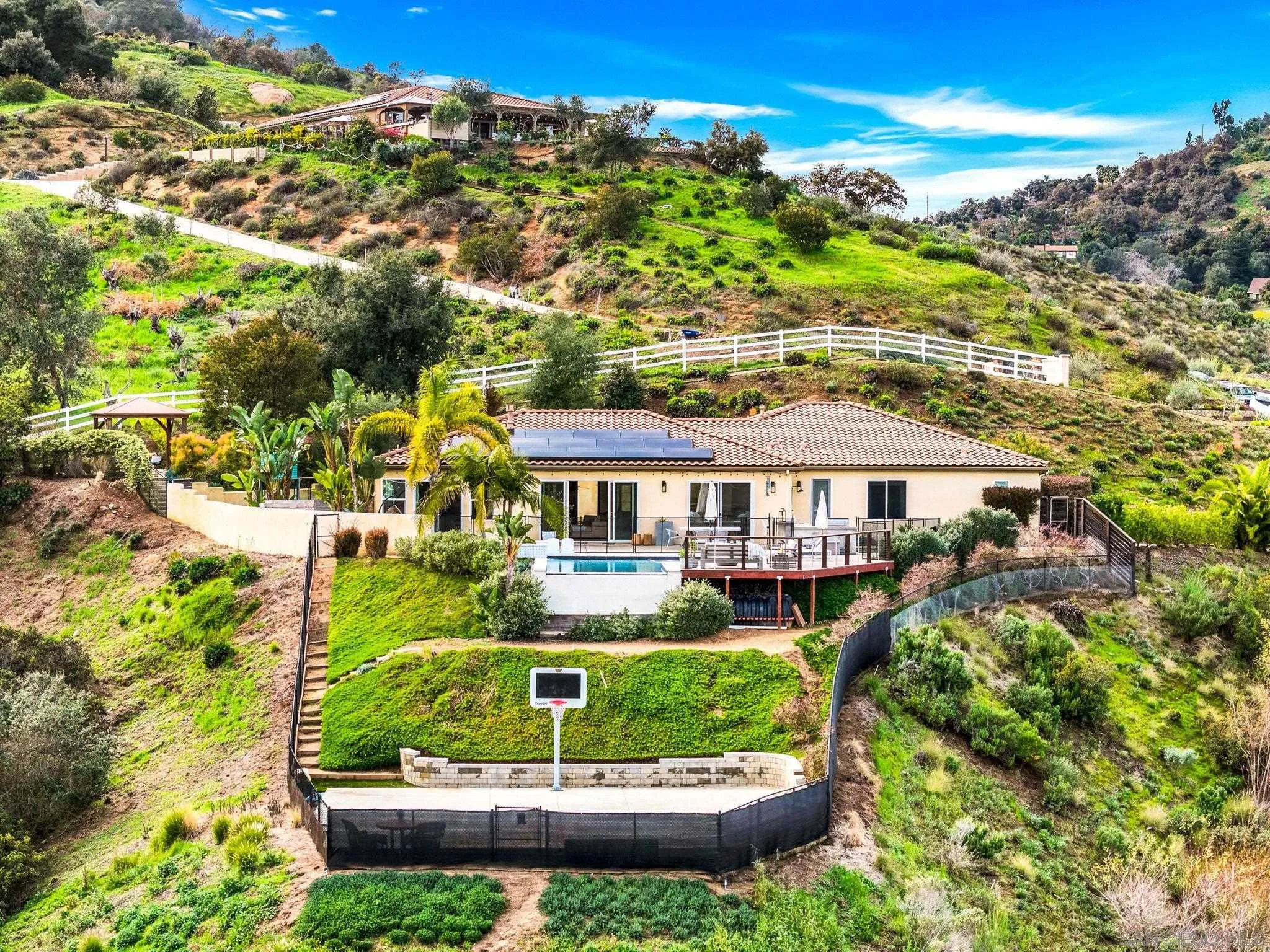2836 Mesa Grove Road Fallbrook, CA 92028 - Photo 2 of 46 a front view of a house with a yard