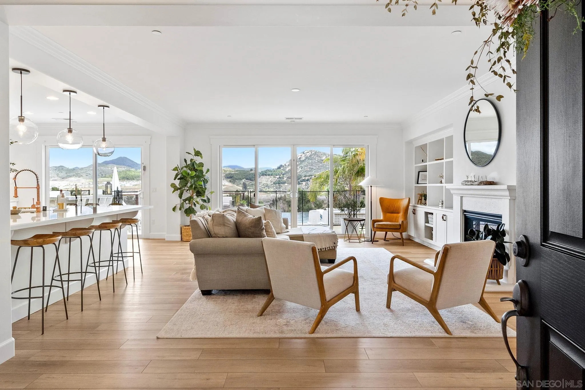 2836 Mesa Grove Road Fallbrook, CA 92028 - Photo 6 of 46 a living room with fireplace furniture and a large window
