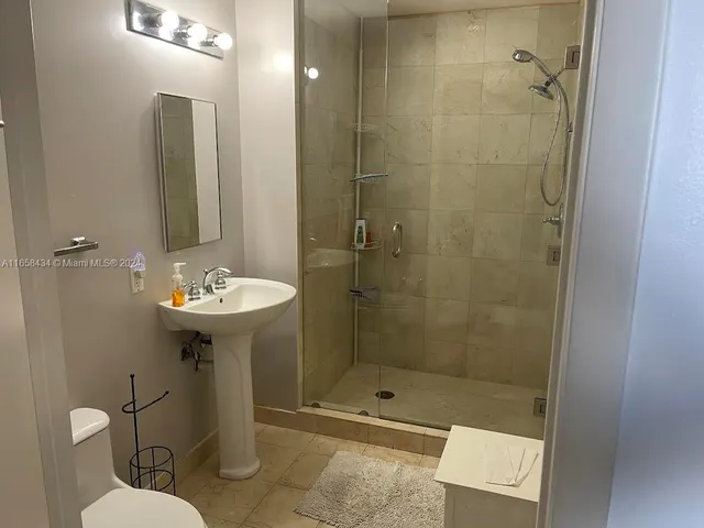 a view of a balcony next to a building