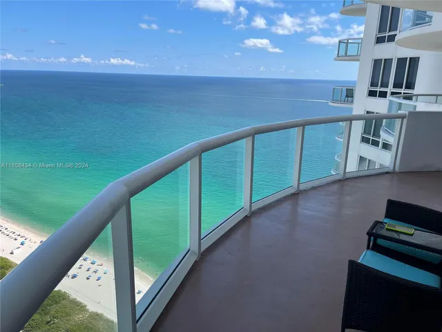 a view of a dining room with furniture and window
