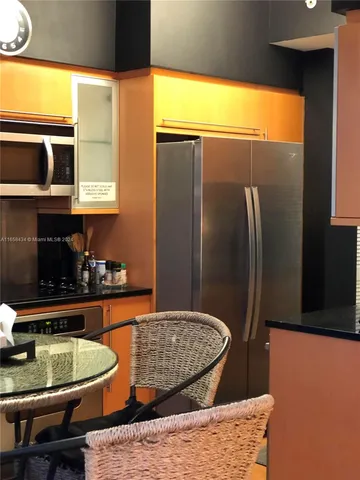 a kitchen with a stove and a microwave