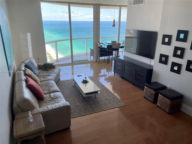 a dining room with table and chairs