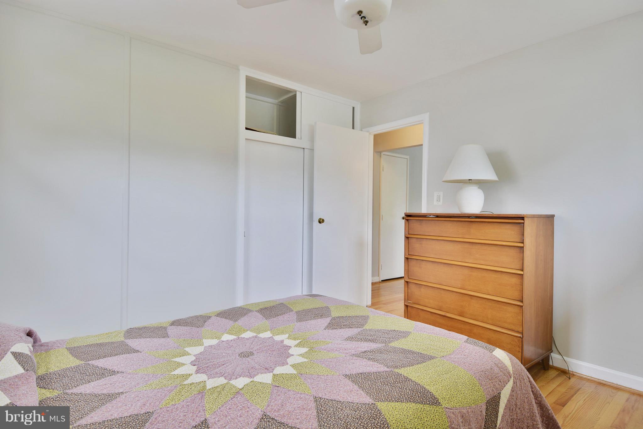12719 Feldon Street Silver Spring, MD 20906 - Photo 20 of 30 a bedroom with a bed and a dresser