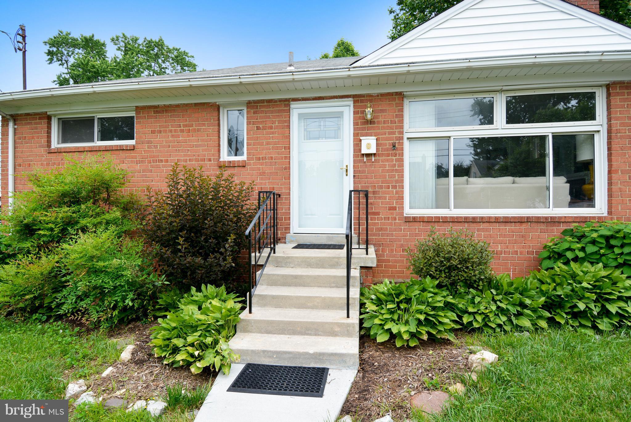 12719 Feldon Street Silver Spring, MD 20906 - Photo 28 of 30 a front view of a house with a garden