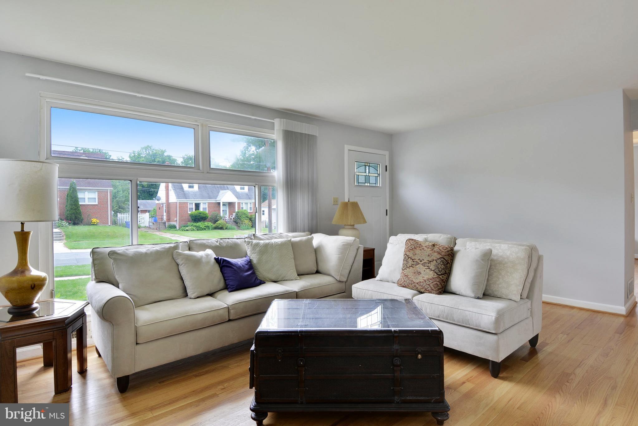 12719 Feldon Street Silver Spring, MD 20906 - Photo 3 of 30 a living room with furniture and a large window