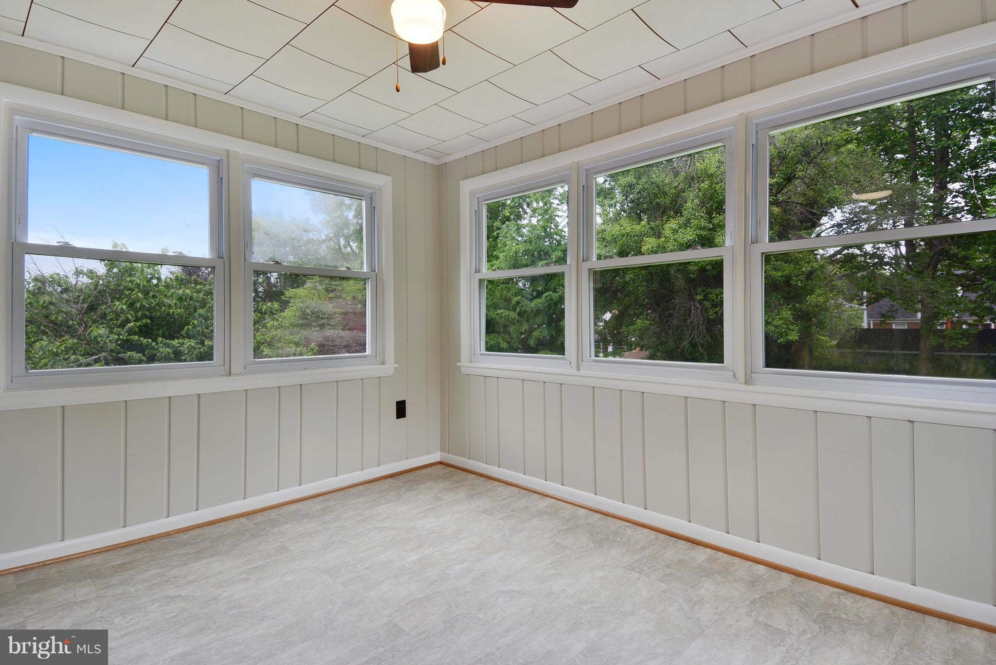 12719 Feldon Street Silver Spring, MD 20906 - Photo 5 of 30 an empty room with windows