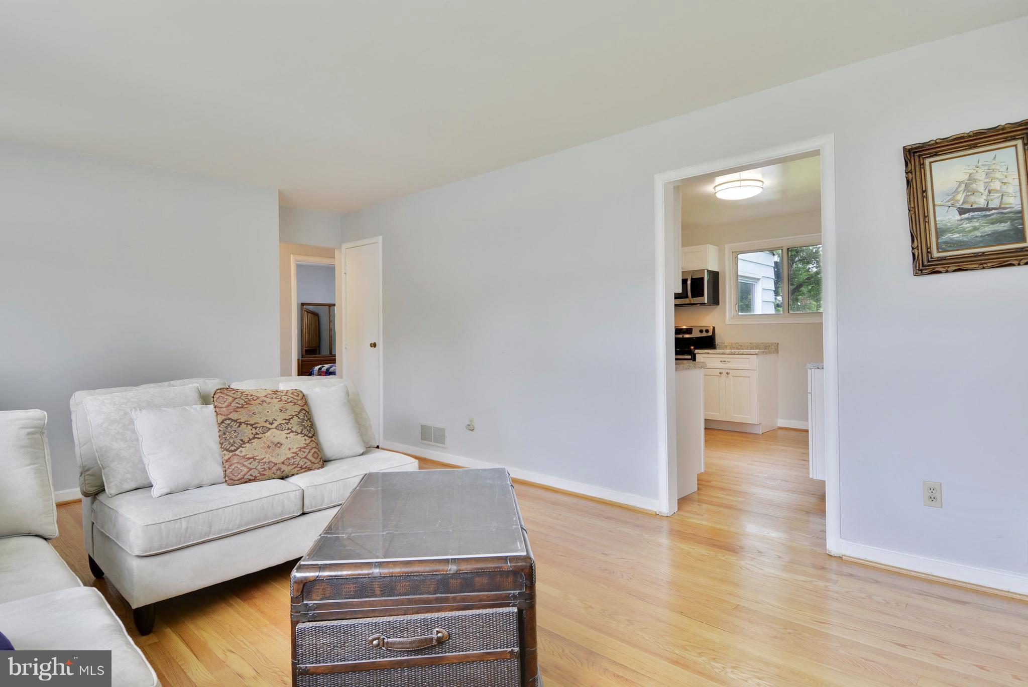 12719 Feldon Street Silver Spring, MD 20906 - Photo 10 of 30 a living room with furniture and wooden floor