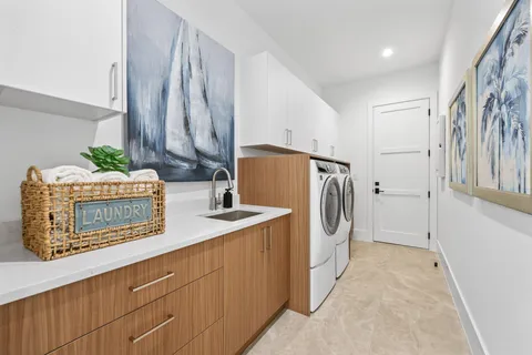 a utility room with cabinets
