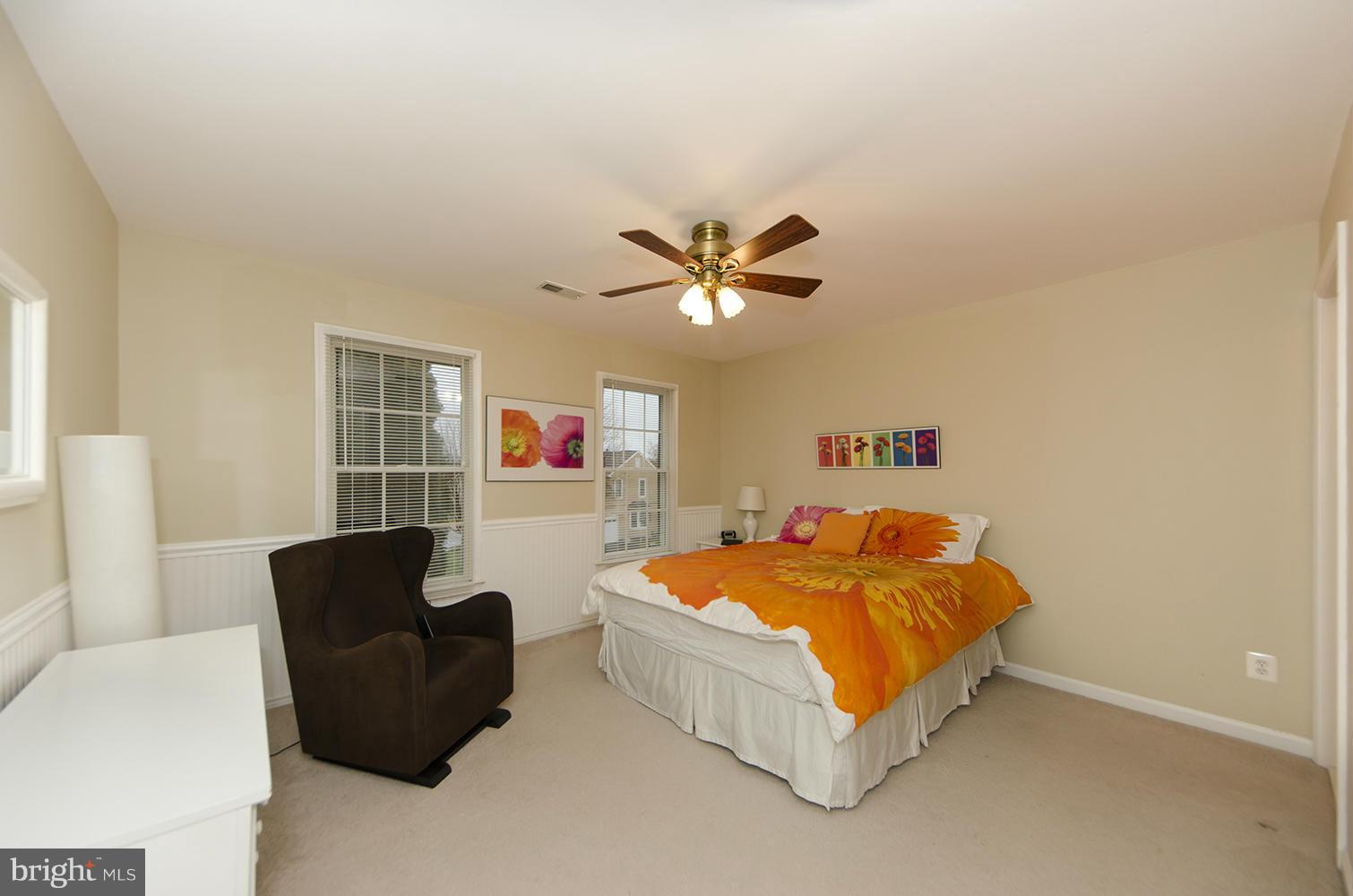 10871 Hunter Gate Way Reston, VA 20194 - Photo 18 of 30 a bedroom with a bed and a couch