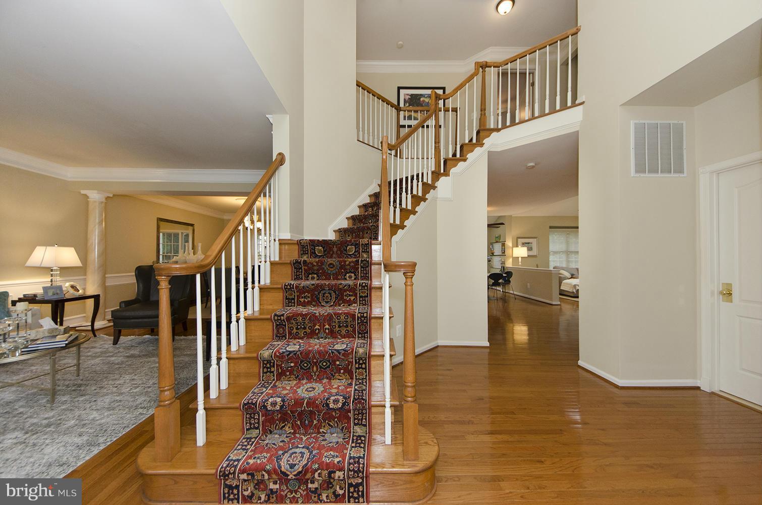 10871 Hunter Gate Way Reston, VA 20194 - Photo 20 of 30 a view of entryway and hall with wooden floor