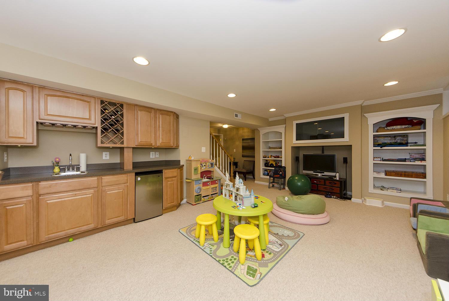 10871 Hunter Gate Way Reston, VA 20194 - Photo 21 of 30 a living room with furniture a flat screen tv and kitchen view