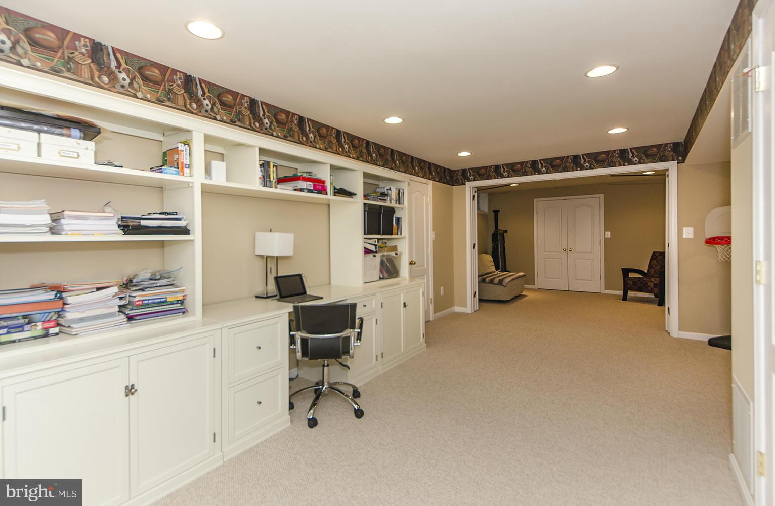 10871 Hunter Gate Way Reston, VA 20194 - Photo 24 of 30 a very nice looking room with a chair and a chandelier