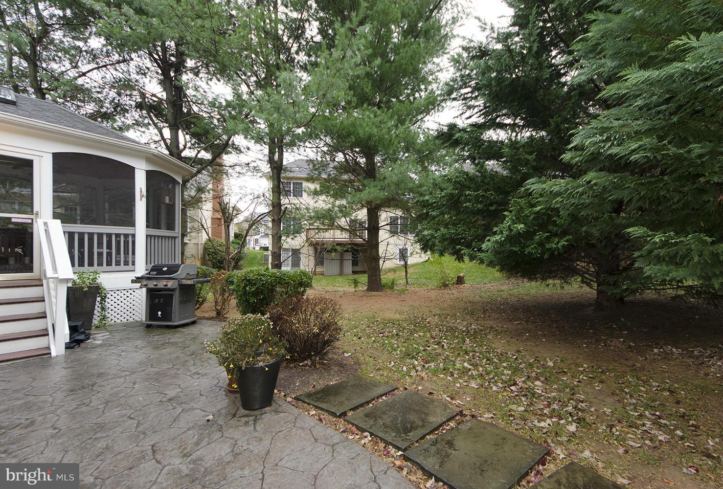 10871 Hunter Gate Way Reston, VA 20194 - Photo 29 of 30 a view of a patio with table and chairs and potted plants