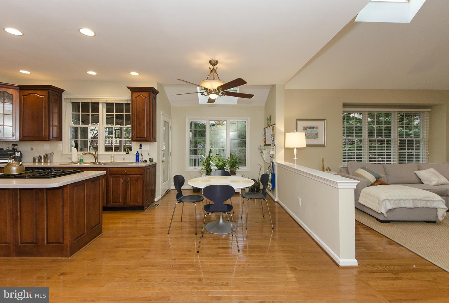 10871 Hunter Gate Way Reston, VA 20194 - Photo 6 of 30 a living room with furniture a large window with kitchen view