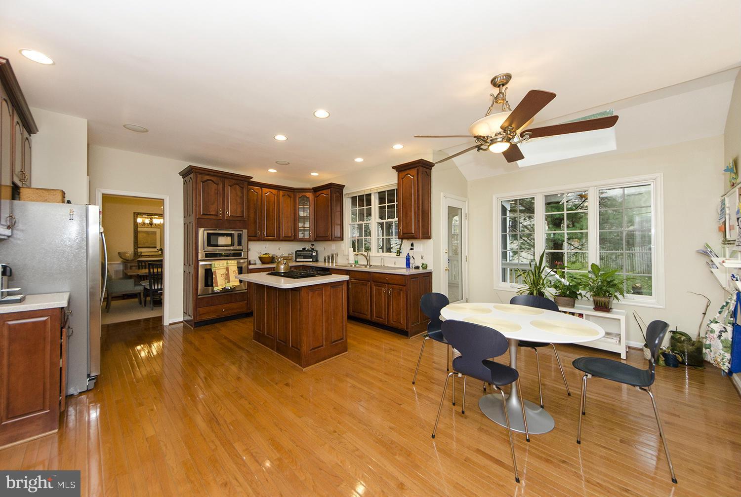 10871 Hunter Gate Way Reston, VA 20194 - Photo 8 of 30 a large kitchen with a large counter top appliances and cabinets