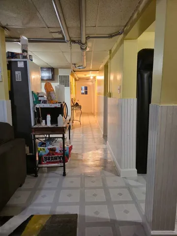 a white toilet sitting next to a bathroom sink