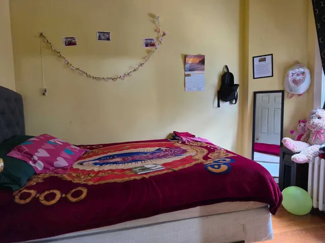 a view of a room with furniture and wooden floor