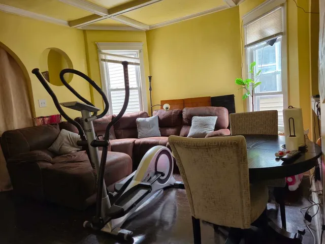 a view of front door with wooden floor