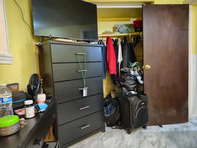 a view of a closet with storage