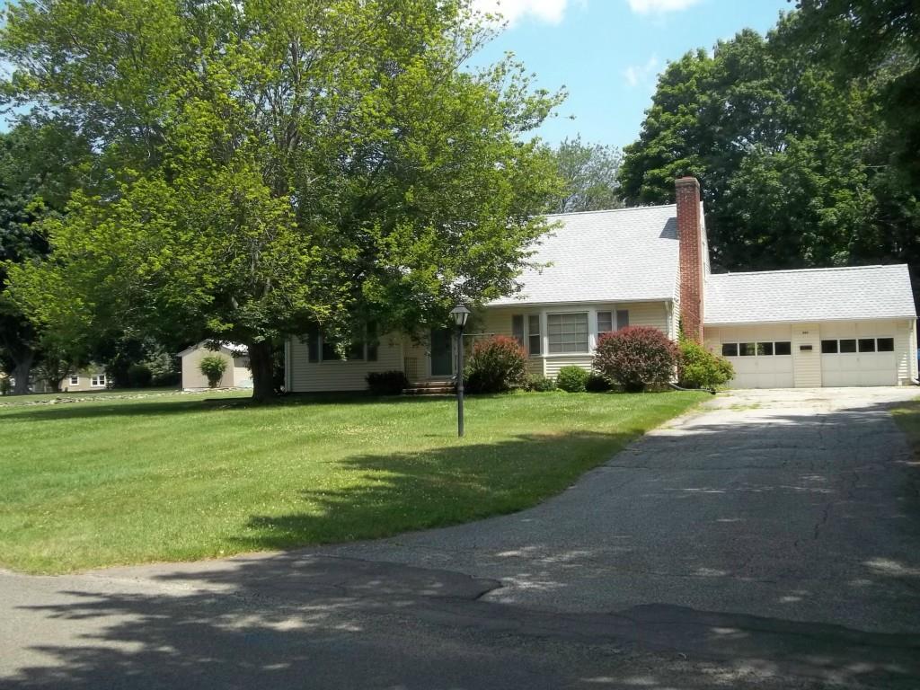 321 Fairlea Road Orange, CT 06477 - Photo 1 of 1 a front view of a house with a yard and trees