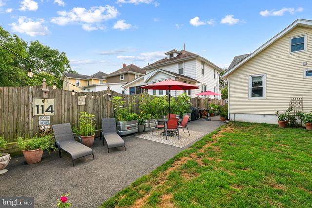 an outdoor view of patio with umbrella