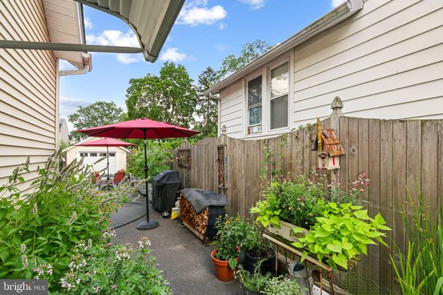 a view of backyard with garden and deck