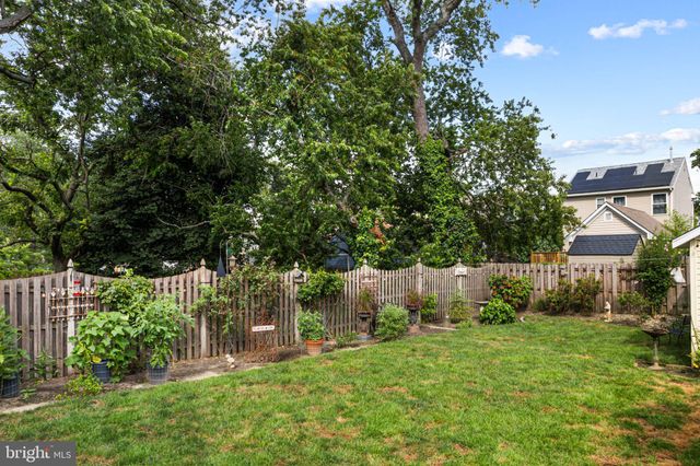 a view of a chair and table under an umbrella