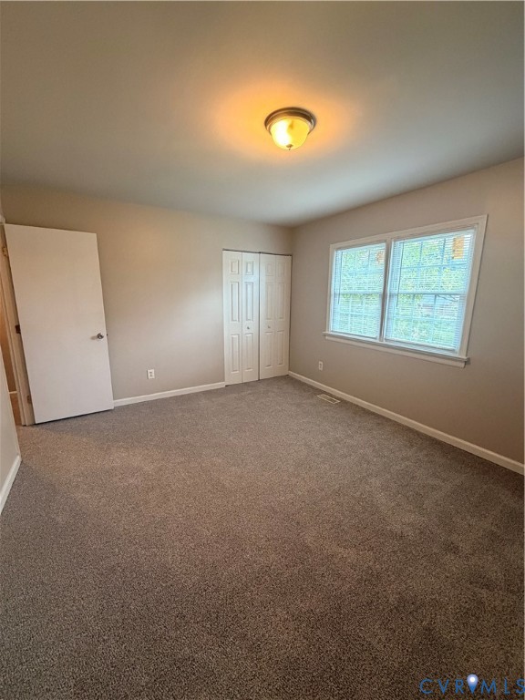 4605 Cogbill Road Richmond, VA 23234 - Photo 18 of 20 Spacious room featuring neutral carpeting, a dual-