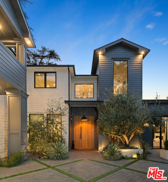 4421 Haskell Avenue Encino, CA 91436 - Photo 2 of 40 a front view of a house with garden