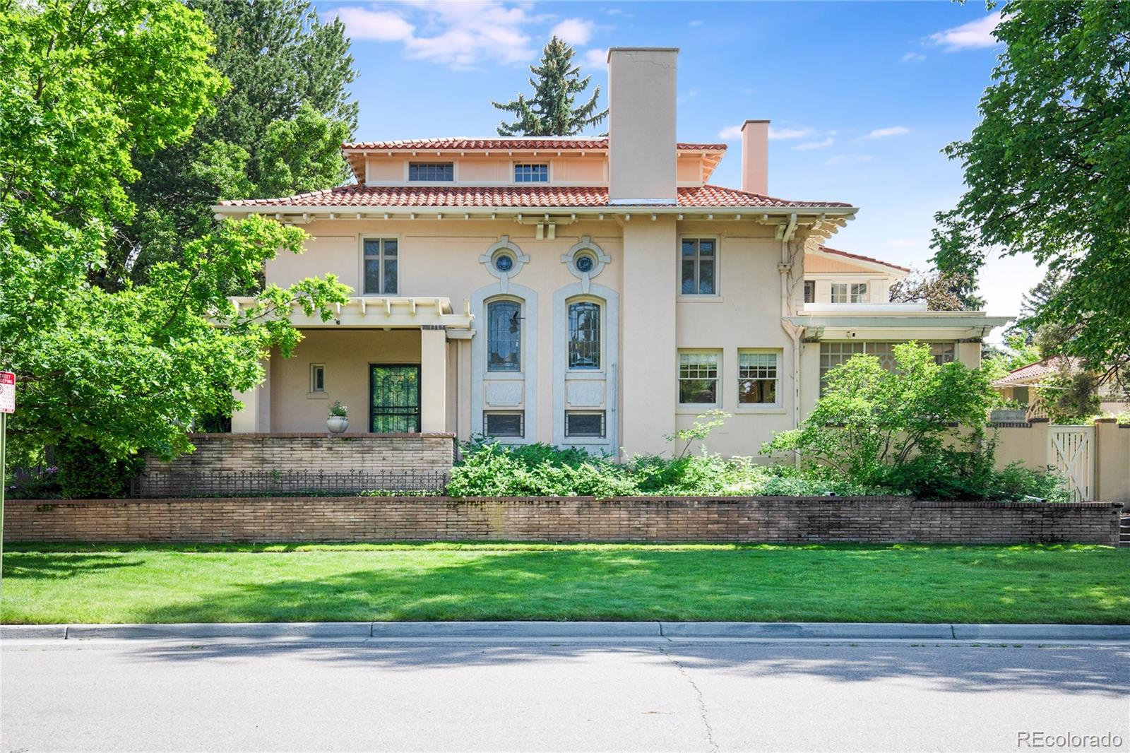 199 Lafayette Street Denver, CO 80218 - Photo 2 of 49 a front view of a house with a garden