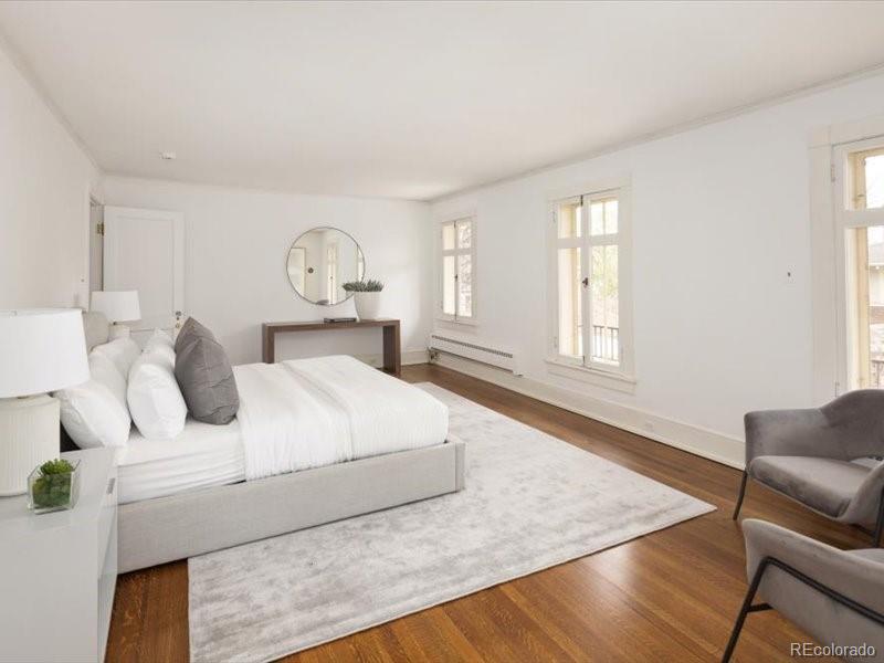 199 Lafayette Street Denver, CO 80218 - Photo 21 of 49 a bedroom with a bed and window