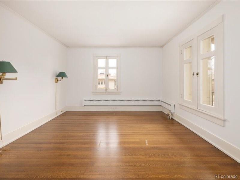 199 Lafayette Street Denver, CO 80218 - Photo 29 of 49 wooden floor in an empty room with a window